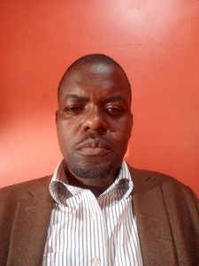 Official portrait of the Deputy Head Teacher of St. John's S.S - Ikumba.