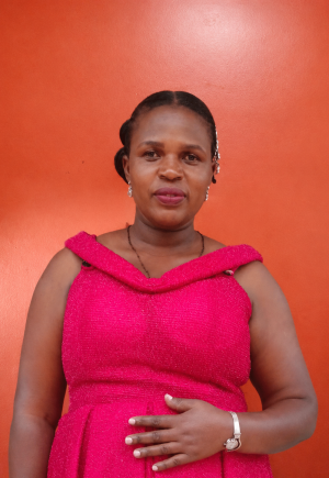 Official portrait of Ms. Atuheire Catherine, the Director of Studies at St. John's S.S - Ikumba.